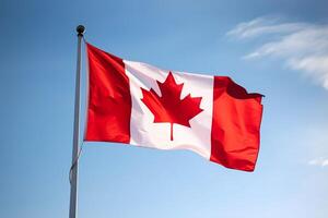 Canadian flag on clear blue sky. photo