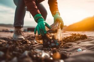 volunteer collects garbage on a muddy beach. The concept of Earth Day. Closeup. photo