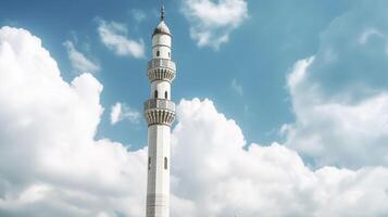 White mosque minaret. Mosque minaret with cloudy sky in background. photo