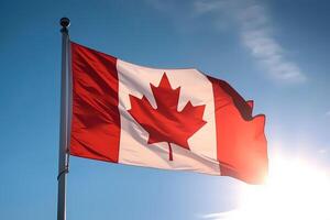 Canadian flag on clear blue sky. photo