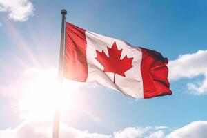 Canadian flag on clear blue sky. photo