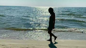 woman walk on beach in summer video