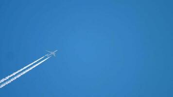 Airplane vapor white trail on blue sky, aircraft layer pollution video