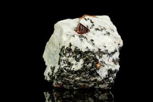 Macro Zircon mineral stone on a black background photo