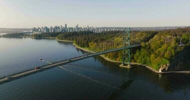 Aerial view of Lions Gate Bridge and Stanley Park at dawn. Canada video