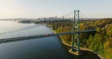 Aerial view of Lions Gate Bridge and Stanley Park at dawn. Canada video