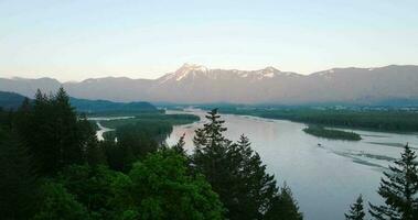 Aerial view of Fraser river valley and mountain landscape in British Columbia video