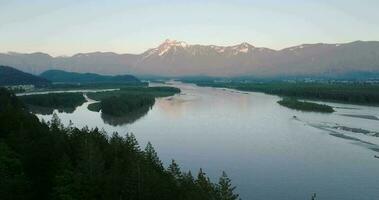 Aerial view of Fraser river valley and mountain landscape in British Columbia video