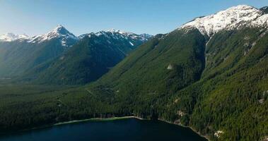 Aerial landscape view of Chilliwack Lake and mountains in spring. video