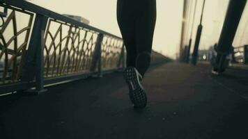 Beautiful sports woman Runner silhouette running fast at sunset. video