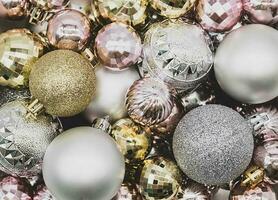 Christmas ornament. Pile of silver, gold and pink Christmas balls photo