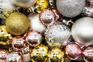 Christmas ornament. Pile of silver, gold and pink Christmas balls photo