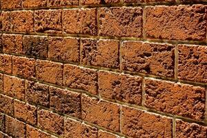 Wall made from Red solid bricks photo