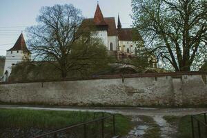 Biertan a very beautiful medieval village in Transylvania, Romania. A historical town in Romania that has preserved the Frankish and Gothic architectural style. Travel photo. photo