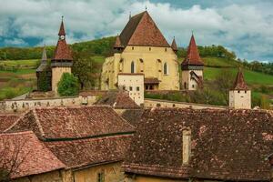 Biertan a very beautiful medieval village in Transylvania, Romania. A historical town in Romania that has preserved the Frankish and Gothic architectural style. Travel photo. photo