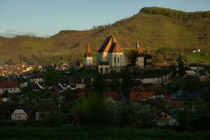 Biertan a very beautiful medieval village in Transylvania, Romania. A historical town in Romania that has preserved the Frankish and Gothic architectural style. Travel photo. photo