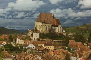 Biertan a very beautiful medieval village in Transylvania, Romania. A historical town in Romania that has preserved the Frankish and Gothic architectural style. Travel photo. photo