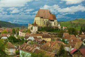 Biertan a very beautiful medieval village in Transylvania, Romania. A historical town in Romania that has preserved the Frankish and Gothic architectural style. Travel photo. photo