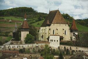 Biertan a very beautiful medieval village in Transylvania, Romania. A historical town in Romania that has preserved the Frankish and Gothic architectural style. Travel photo. photo