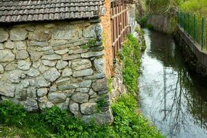 Rimetea is a small village located in Transylvania, Romania. It is situated in the Apuseni Mountains and is known for its picturesque setting and well preserved Hungarian architectural style. photo