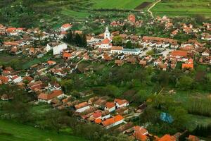 Rimetea is a small village located in Transylvania, Romania. It is situated in the Apuseni Mountains and is known for its picturesque setting and well preserved Hungarian architectural style. photo