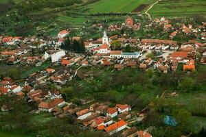 Rimetea is a small village located in Transylvania, Romania. It is situated in the Apuseni Mountains and is known for its picturesque setting and well preserved Hungarian architectural style. photo