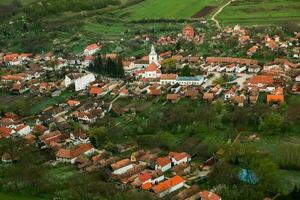 Rimetea is a small village located in Transylvania, Romania. It is situated in the Apuseni Mountains and is known for its picturesque setting and well preserved Hungarian architectural style. photo