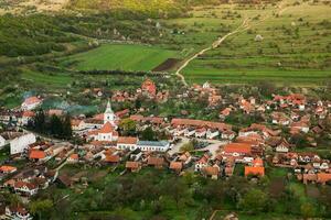 Rimetea is a small village located in Transylvania, Romania. It is situated in the Apuseni Mountains and is known for its picturesque setting and well preserved Hungarian architectural style. photo