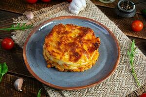 Classic lasagna with minced chiken bolognese sauce and bechamel sauce photo