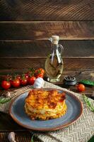 Classic lasagna with minced chiken bolognese sauce and bechamel sauce photo