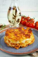 Classic lasagna with minced chiken bolognese sauce and bechamel sauce photo