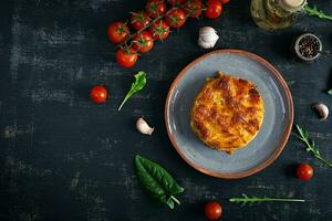Classic lasagna with minced chiken bolognese sauce and bechamel sauce. Top view photo