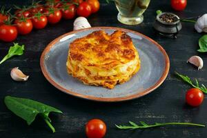 Classic lasagna with minced chiken bolognese sauce and bechamel sauce photo