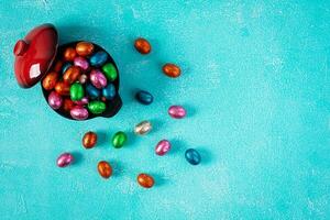 Colorful background of Easter chocolate eggs. Delicious chocolate eggs. Top view photo