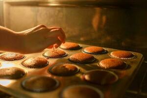 Cupcakes baking on a home stove. photo