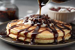 stock photo of warm pancake with chocolate syrup food photography