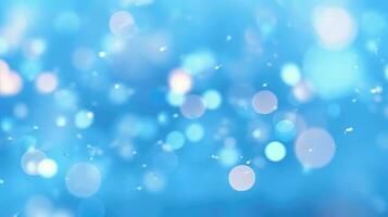 Abstract light blue blurred background with beautiful lighting spots and reflections photo