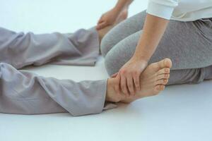 Hand making thai feet massage. Alternative medicine and thai massage concept photo