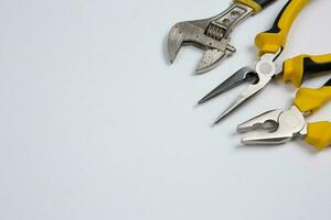 Set of tools for construction or the house. Wrench, pliers, hammer, screwdriver, flashlight, bold, scissors, knife and others. photo