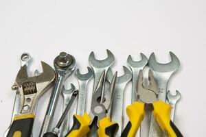 Set of tools for construction or the house. Wrench, pliers, hammer, screwdriver, flashlight, bold, scissors, knife and others. photo