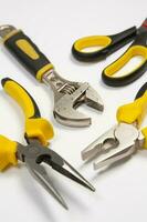 Set of tools for construction or the house. Wrench, pliers, hammer, screwdriver, flashlight, bold, scissors, knife and others. photo