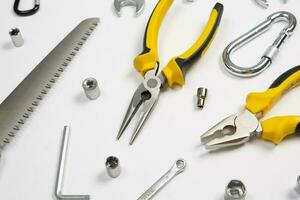 Set of tools for construction or the house. Wrench, pliers, hammer, screwdriver, flashlight, bold, scissors, knife and others. photo