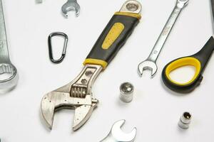 Set of tools for construction or the house. Wrench, pliers, hammer, screwdriver, flashlight, bold, scissors, knife and others. photo