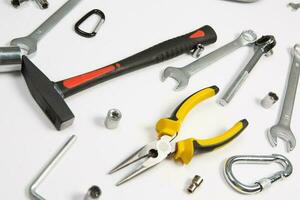 Set of tools for construction or the house. Wrench, pliers, hammer, screwdriver, flashlight, bold, scissors, knife and others. photo