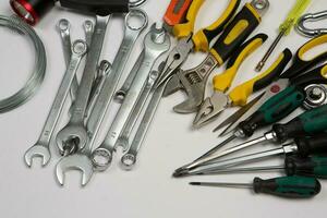 Set of tools for construction or the house. Wrench, pliers, hammer, screwdriver, flashlight, bold, scissors, knife and others. photo