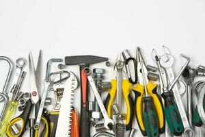 Set of tools for construction or the house. Wrench, pliers, hammer, screwdriver, flashlight, bold, scissors, knife and others. photo