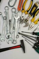 Set of tools for construction or the house. Wrench, pliers, hammer, screwdriver, flashlight, bold, scissors, knife and others. photo