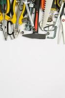 Set of tools for construction or the house. Wrench, pliers, hammer, screwdriver, flashlight, bold, scissors, knife and others. photo