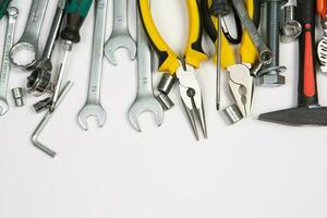 Set of tools for construction or the house. Wrench, pliers, hammer, screwdriver, flashlight, bold, scissors, knife and others. photo