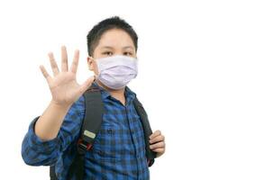 Asian boy student wear mask and waving goodbye before go to school photo